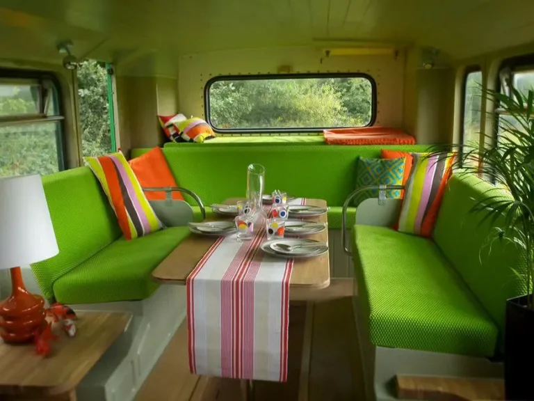 Single dad turns an old double-decker bus into fun and vibrant home-on-wheels for him and his daughter